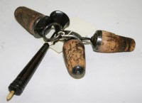 Lot 590 - Three 19th Century bottle corks, with ring...