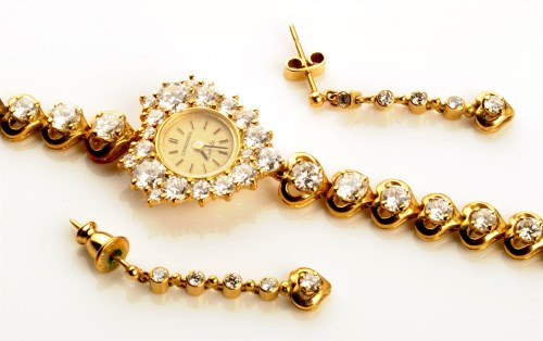 Lot 704 - A Longines diamond set 18ct. gold cased lady's...