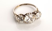 Lot 810 - A three stone diamond ring, all brilliant cut,...