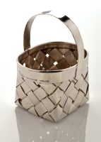 Lot 667 - A Cartier hand-made sterling basket with oval...