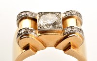 Lot 909 - An Art Deco diamond ring, the central...