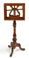 Lot 1219 - A Victorian walnut duet music stand, each side...