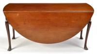 Lot 1221 - A George III mahogany drop leaf dining table,...