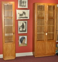 Lot 91 - Two Ercol Windsor light elm wall units, the...
