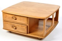 Lot 93 - An Ercol light elm 'Pandora' style coffee...