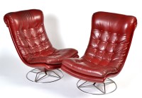 Lot 104 - Two mid 20th Century red leather cloth swivel...