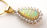 Lot 662 - An opal and diamond cluster pendant, the...