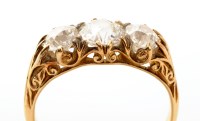 Lot 677 - An early 20th Century three stone diamond ring,...