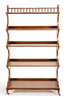 Lot 1249 - A Victorian walnut graduated open waterfall...