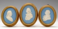 Lot 116 - Three Wedgwood blue Jasperware portrait...
