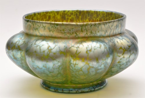 Lot 1017 - A Loetz style lobed circular dish, irredescent...