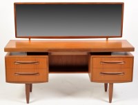 Lot 1119 - G-Plan: a teak Fresco Range dressing table,...