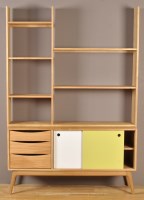 Lot 1220 - Nick James: an oak bookcase unit, fitted open...