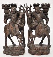 Lot 64 - Pair of hardwood plaques, each with a figure...