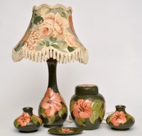 Lot 105 - Moorcroft hibiscus pattern green ground wares,...