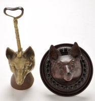 Lot 283 - An early 20th Century brass doorstop with iron...