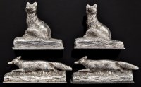 Lot 404 - Four George V silver fox pattern menu stands,...