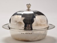 Lot 443 - A George V silver muffin dish and cover, by...