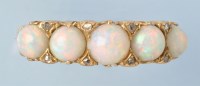 Lot 717 - An opal and diamond ring, the graduated...