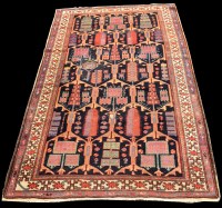 Lot 823 - A Bakhtiari rug, with geometric floral panels...
