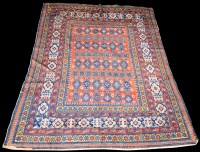 Lot 824 - A Caucasian rug, the repeated floral design on...