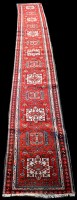 Lot 856 - A Karajeh runner, with thirteen medallions on...