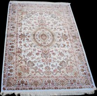 Lot 885 - A woven silk rug, with central floral...
