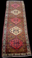 Lot 888 - A Persian runner, with five medallions on...