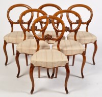 Lot 954 - A set of six Victorian walnut balloon back...
