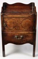 Lot 1011 - A George III mahogany commode, the shaped...