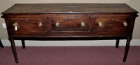Lot 1018 - An 18th Century oak sideboard, the plank top...
