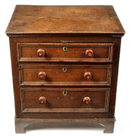 Lot 1019 - An 18th Century oak chest of three long...