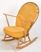 Lot 23 - Ercol: a light stained beech spindle back...
