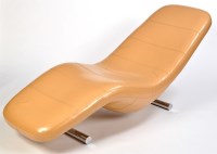 Lot 52 - A modern cream leather lounger on chromed...