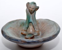 Lot 144 - Manner of Daisy Makeig Jones: a terracotta...