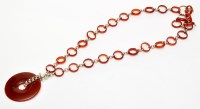 Lot 173 - Hoorieh Coish: a carnelian and silver hoop...