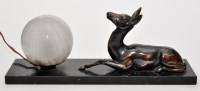 Lot 188 - An Art Deco style table lamp with recumbent...