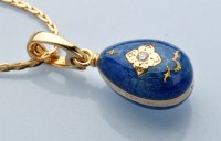 Lot 860 - A diamond, enamel and 18ct. yellow gold...