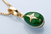 Lot 861 - A diamond, enamel and 18ct. yellow gold...