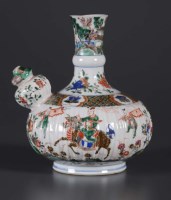Lot 448 - A Famille Vert Kendi, Kangxi period, painted...