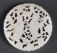 Lot 481 - A circular jade pendant, the pale celadon...