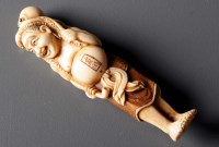Lot 495 - An early 20th Century netsuke, signed Tomo*,...