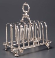 Lot 617 - A George IV seven bar toast rack, by W.E.,...