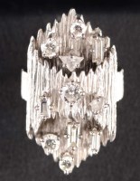 Lot 877 - A diamond and white gold coloured dress ring,...