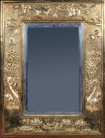 Lot 1045 - An Arts & Crafts wall mirror, the rectangular...