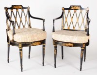 Lot 1370 - A pair of Regency style ebonised open...