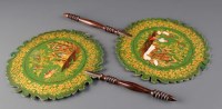 Lot 570 - A pair of 19th Century face screens, with...
