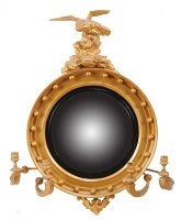 Lot 975 - A late Regency gilt painted convex wall mirror,...