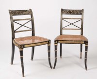Lot 1101 - A pair of Regency black painted parcel gilt...