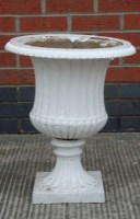 Lot 1119 - A late 19th Century cast iron garden urn,...